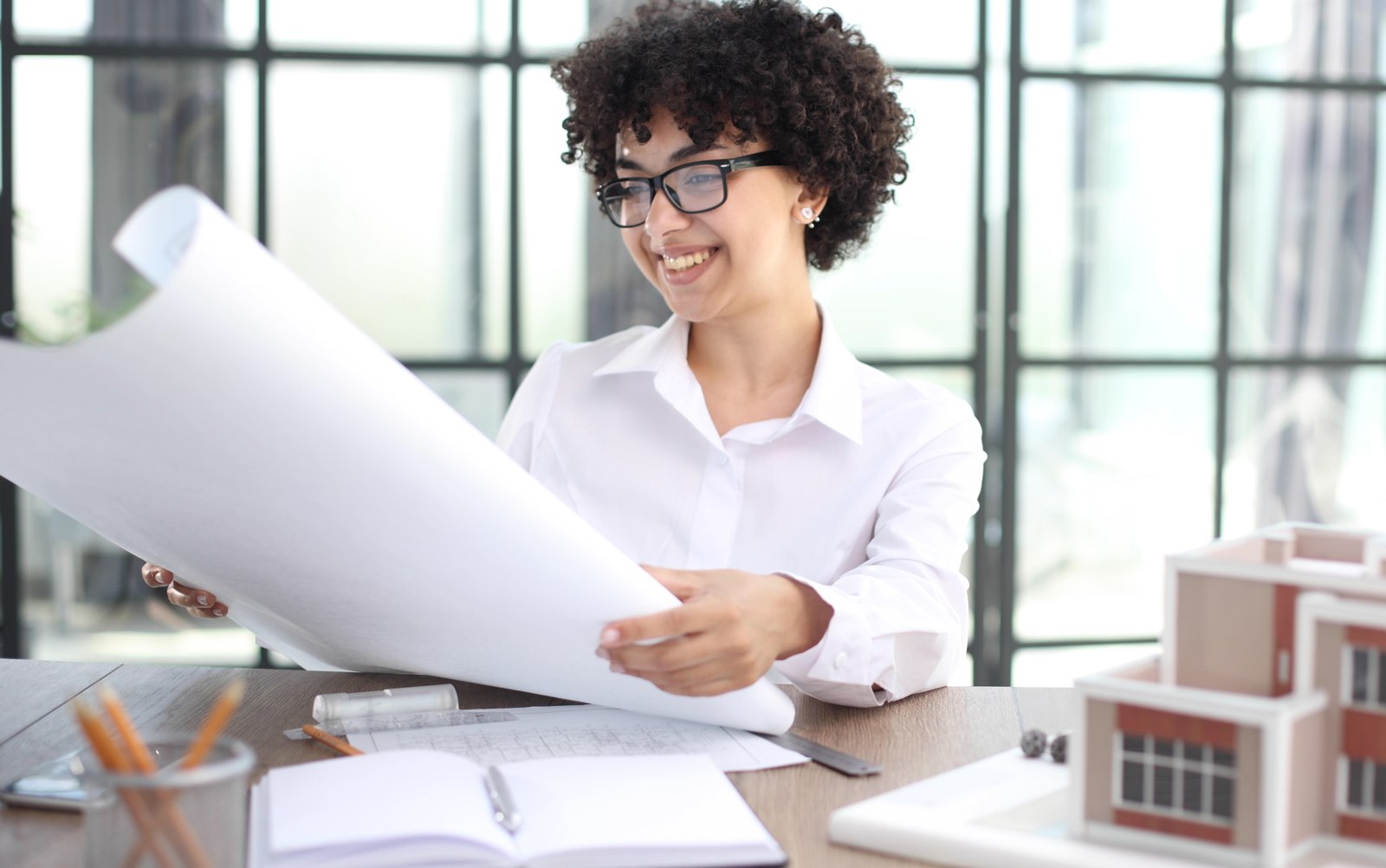 Property professional reviewing building plans and records